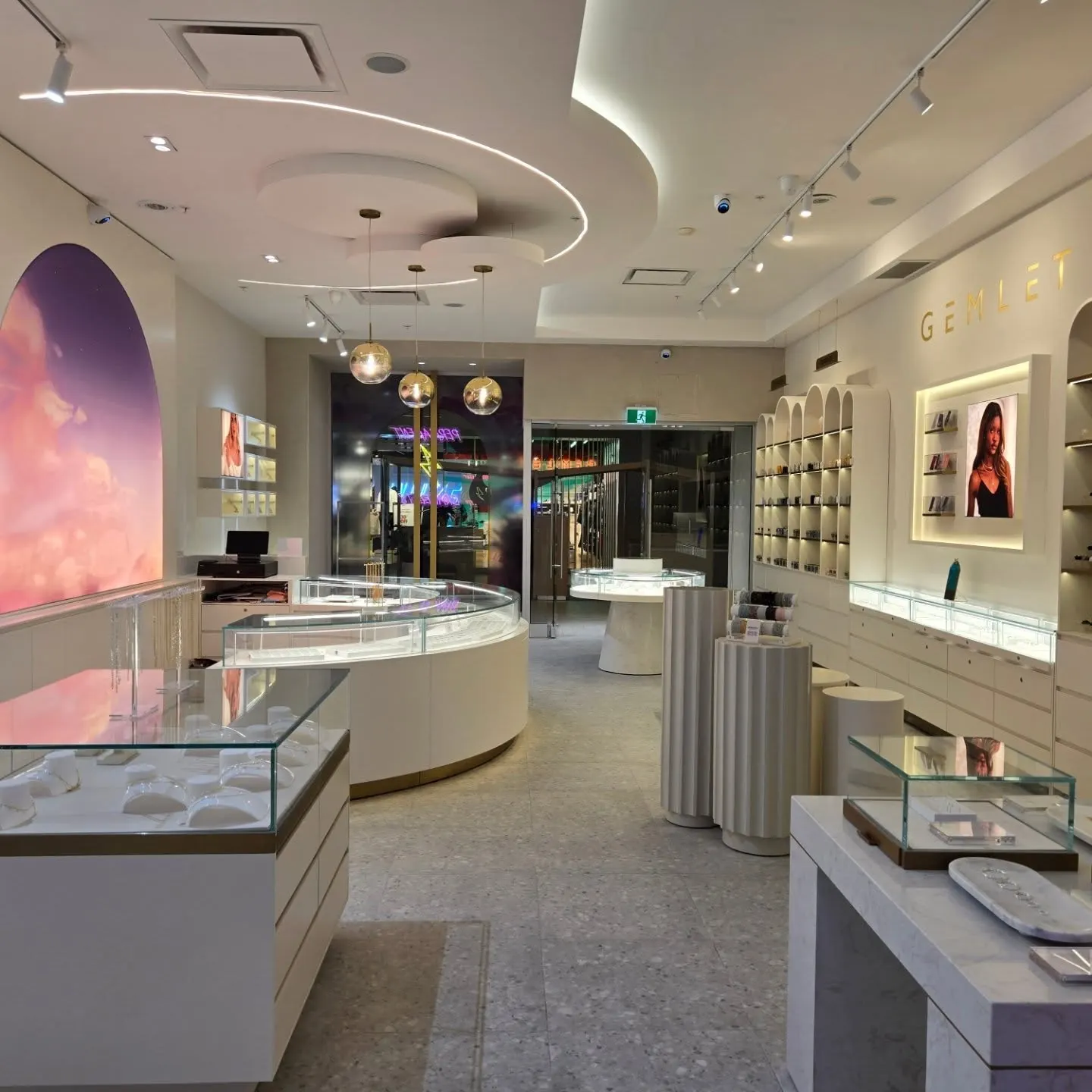 Gemlet jewelry store interior at CF Masonville Place, London, with LED cove ceilings and lit display cases